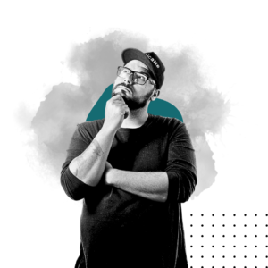 A thoughtful man with glasses and a cap, deep in contemplation, surrounded by abstract teal and gray shapes.