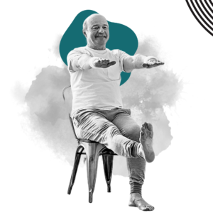 An older man performing seated leg exercises, smiling confidently, with abstract teal and gray shapes in the background.