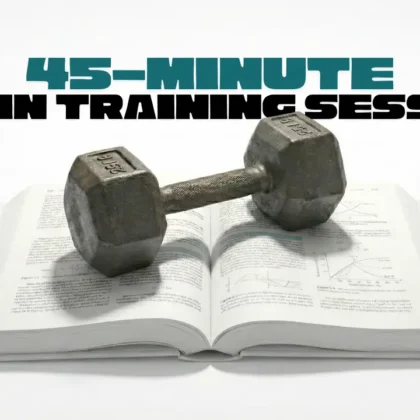 A dumbbell placed on an open book representing a 45 minute brain training session focused on strengthening memory focus and mental performance